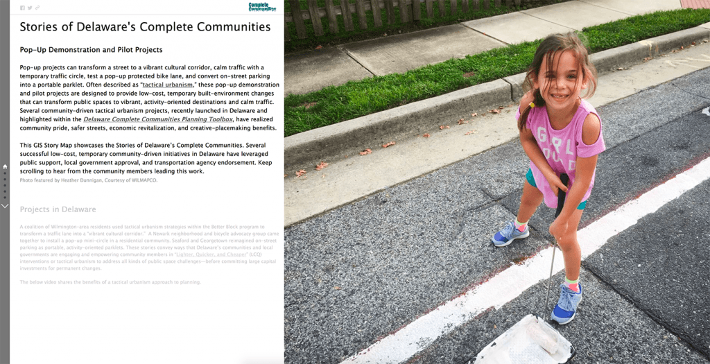 A screenshot of the opening page of the Tactical Urbanism GIS story map which features a young girl smiling as she helps to paint lines on the street for a pop-up projects.