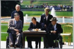 George H.W. Bush signs the Americans with Disabilities Act.