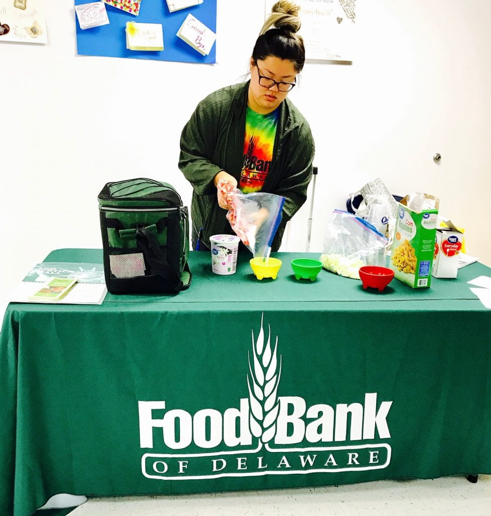 Image showing a food bank WIC Education Specialist conducting a healthy eating demonstration.