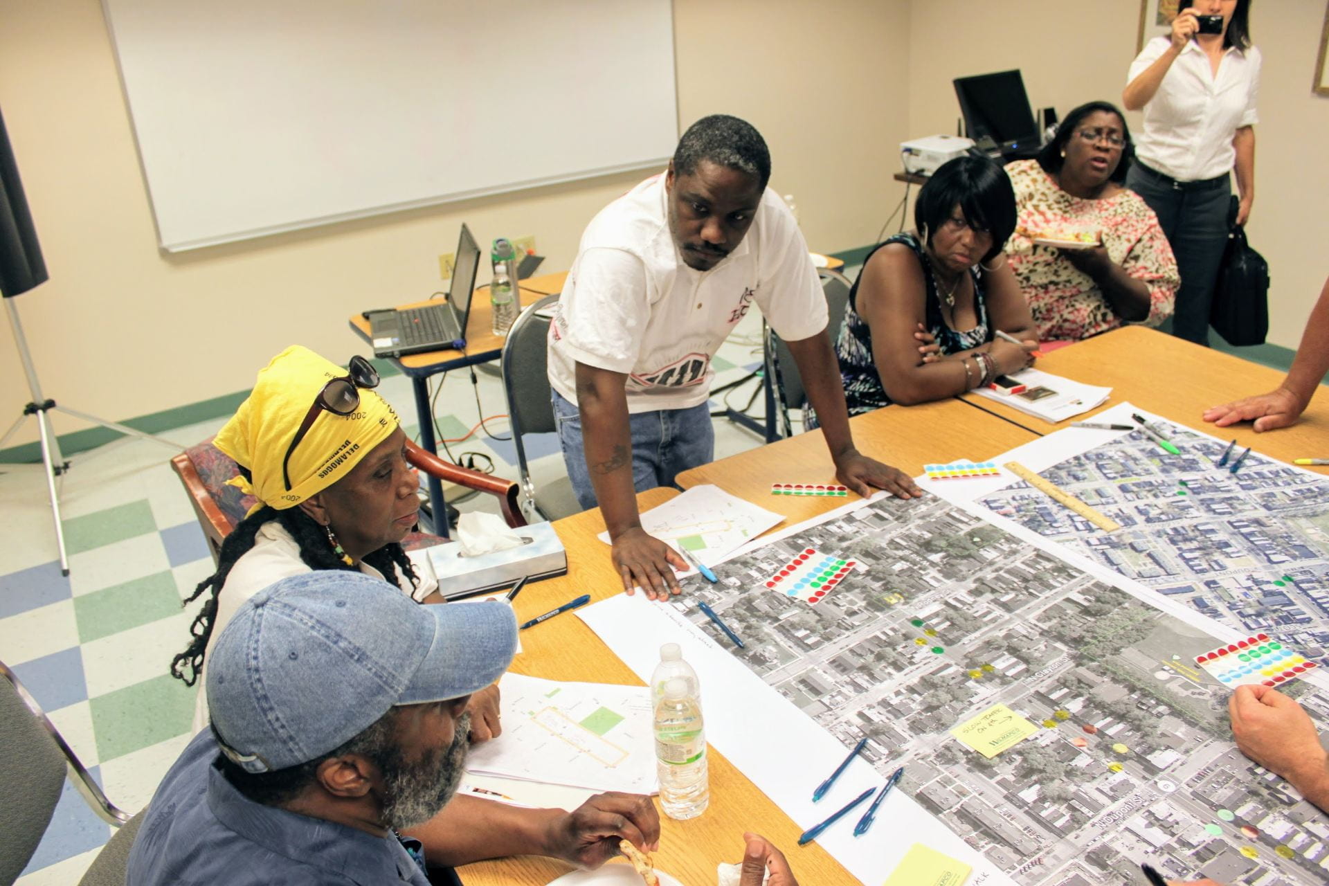 Community members review maps during public engagement workshop.