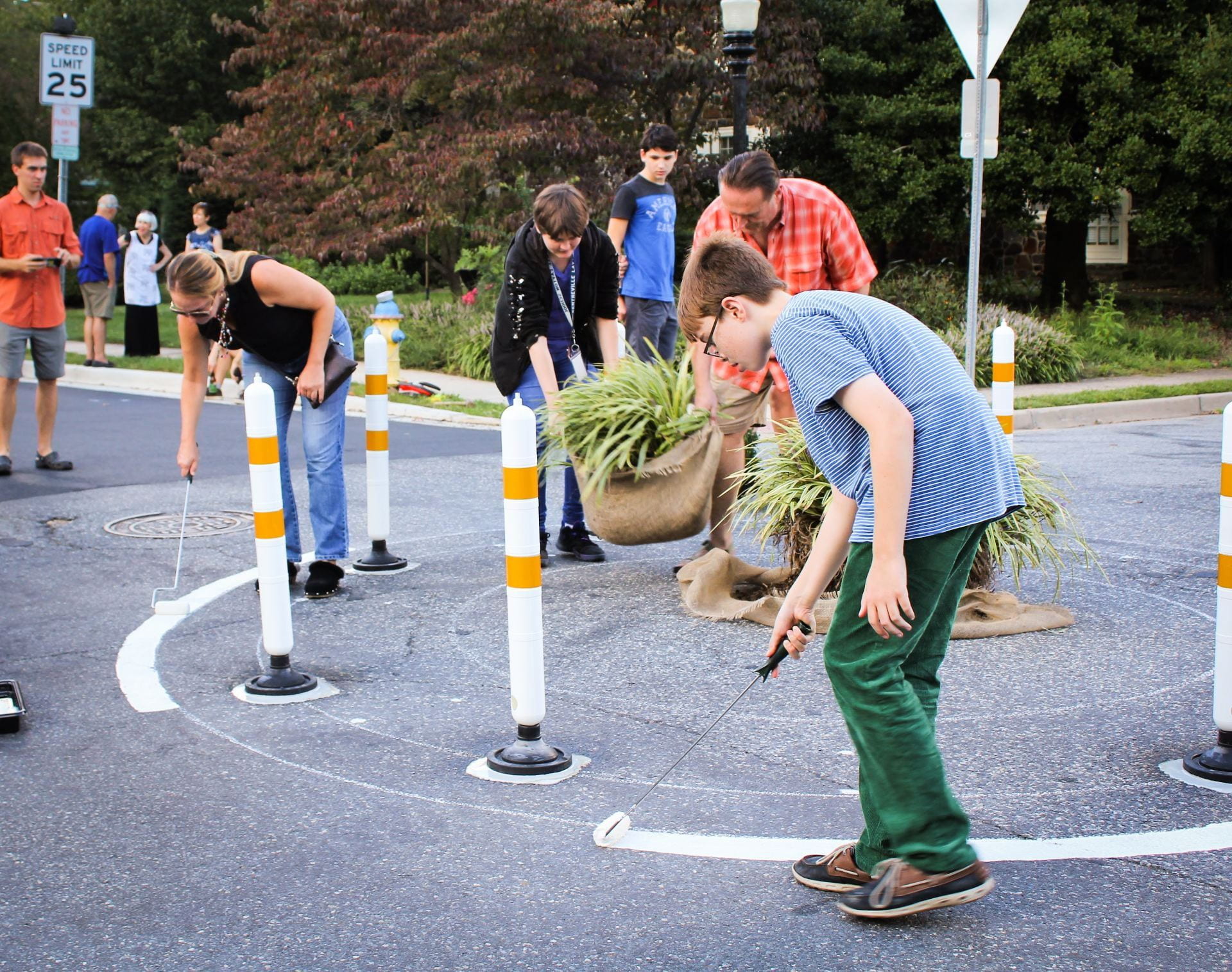 Newark residents paint temporary roundabout on road for pop-up demonstration.